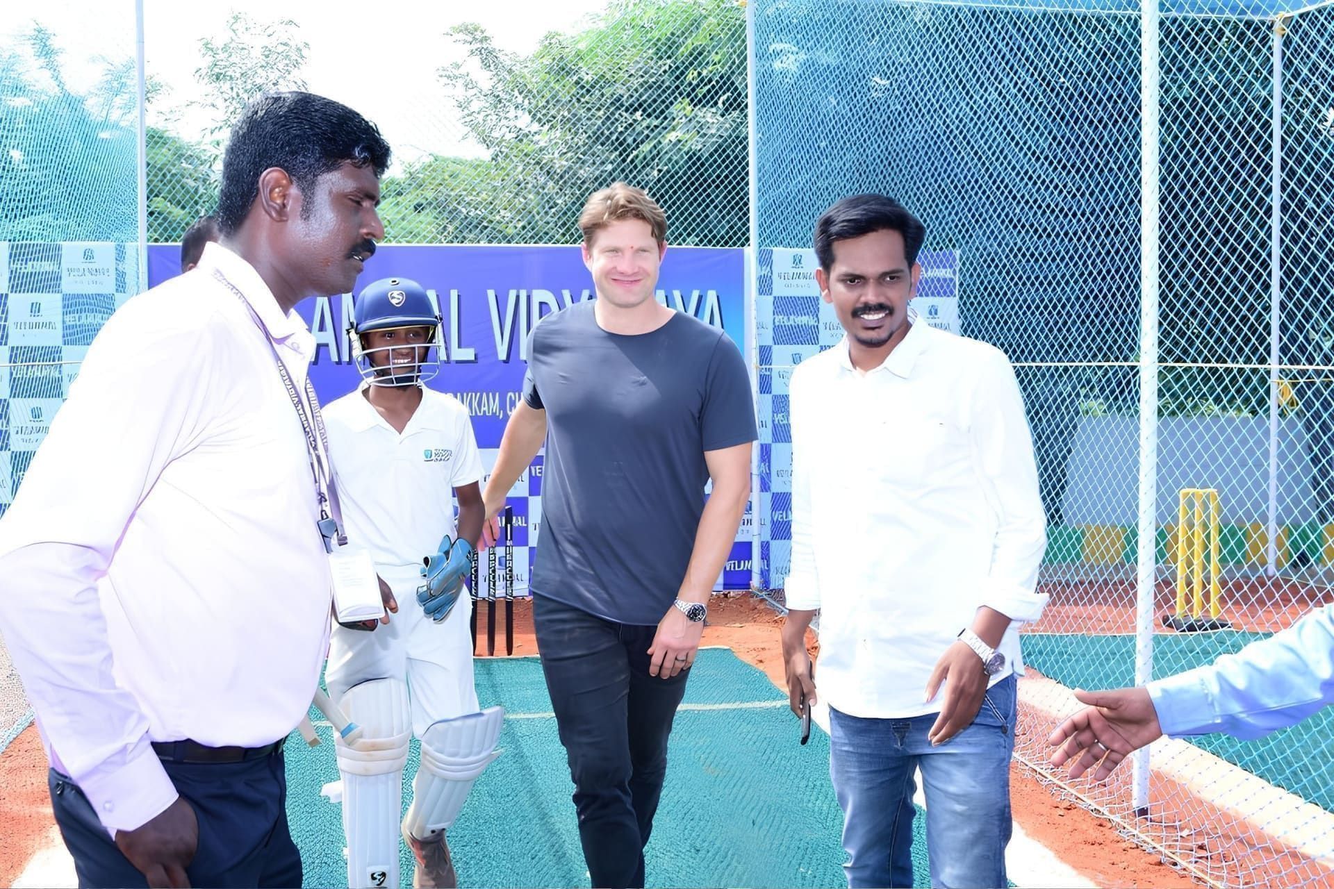 Shane Watson at a cricket net session with a young batter at Velammal Vidyalaya