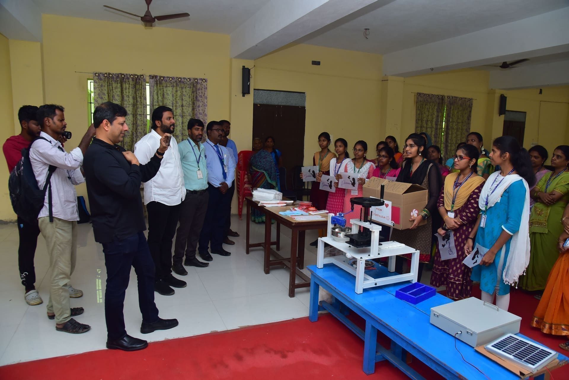 Guests meeting students and staff in a classroom