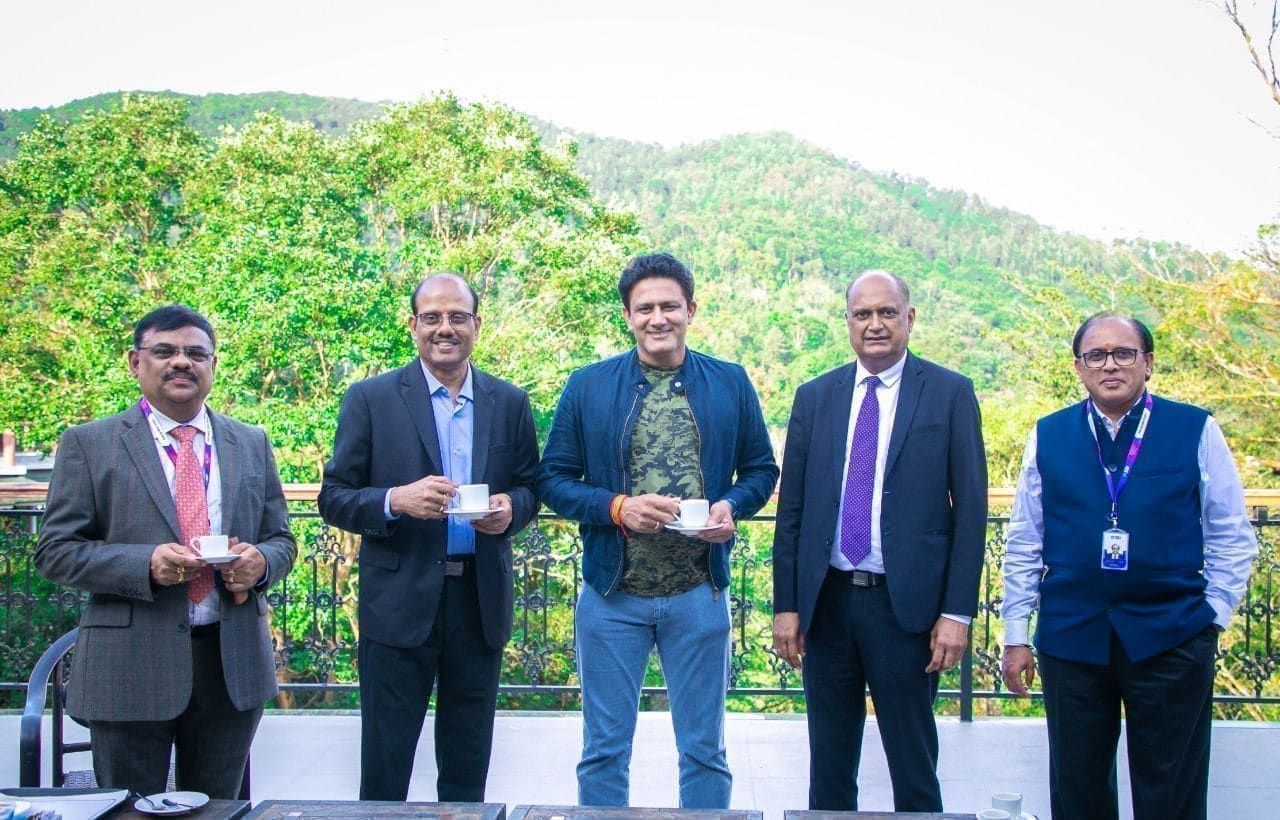 Five delegates gathering outdoors at a leadership event