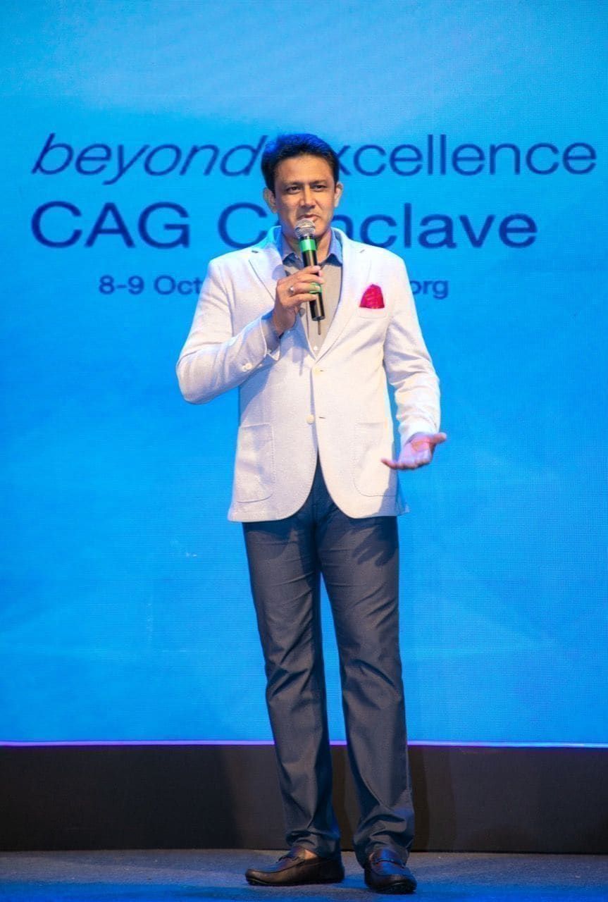 Speaker in a white jacket addressing the SBI conclave