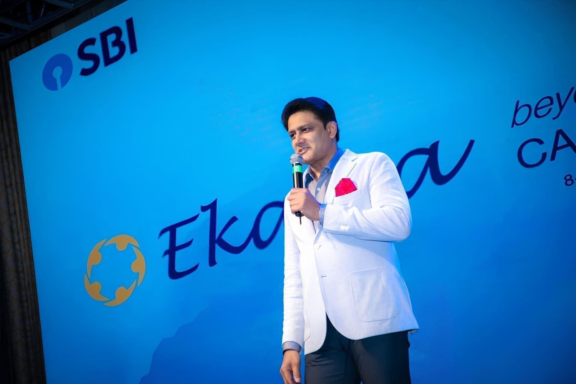Speaker addressing an audience on stage at an SBI-backed summit